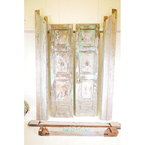 1230 - Architectural salvage: A pair of Indian teak storm doors, with frame, each door with four moulded an... 