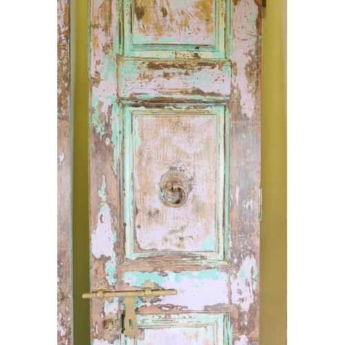 1230 - Architectural salvage: A pair of Indian teak storm doors, with frame, each door with four moulded an... 