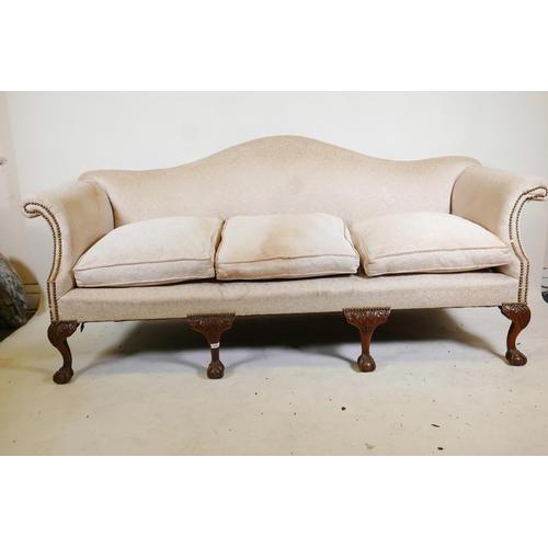 1231 - A Chippendale style humpback settee, with scroll arms, raised on carved cabriole supports with claw ... 