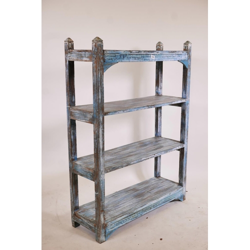 1236 - An Indian hardwood four tier open shelf with distressed paintwork, 36