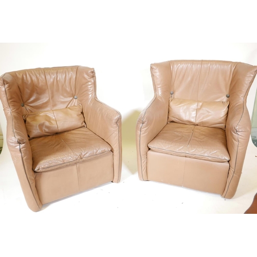 1255 - A pair of retro 1970s leather wing back armchairs, 36