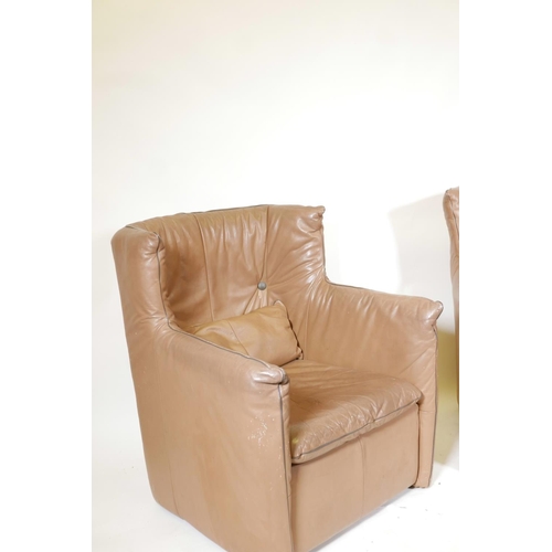 1255 - A pair of retro 1970s leather wing back armchairs, 36