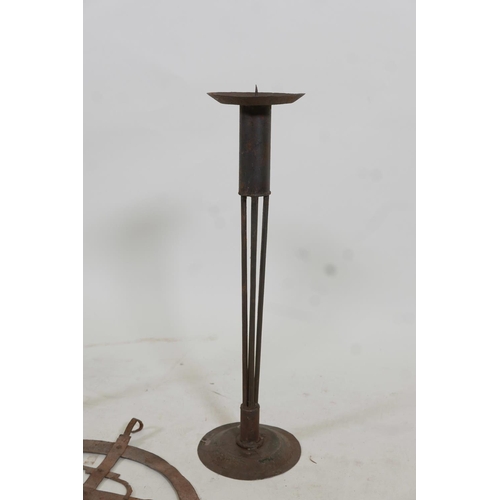 126 - A pair of wrought metal pricket candlesticks and a riveted metal wall bracket, 17½