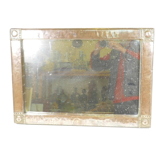 1263 - An Arts and Crafts copper framed wall mirror, 28