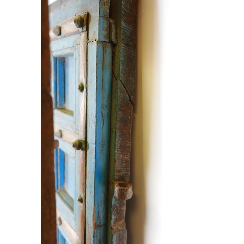 1267 - Architectural salvage: A pair of Indian hardwood panelled storm doors, with brass sheathed iron stra... 