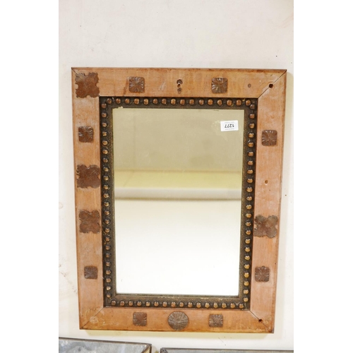 1277 - An Indian wood wall mirror with decorative metal mounts, 24