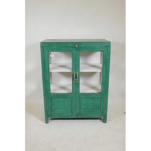 1287 - An Indian painted hardwood two door display cabinet, lacks one glass pane to side, 30