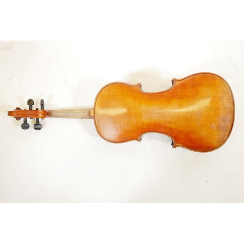 129 - A late C19th/early C20th violin in ebonised wood case, no label, one piece back, split to front, and... 