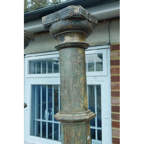 1301 - Architectural Salvage: A pair of Indian painted teak columns with carved capitals, mounted on carved... 