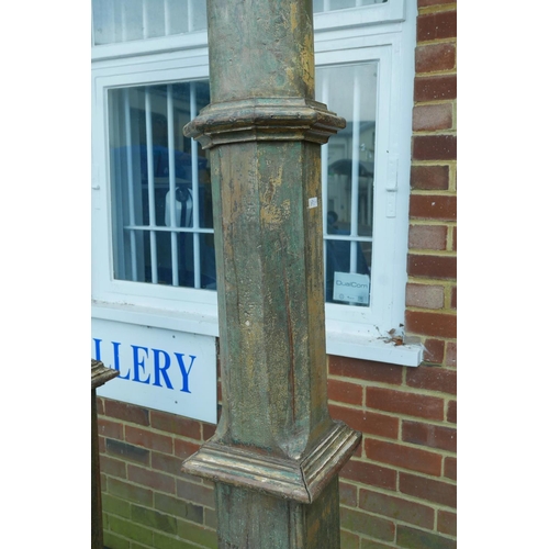 1301 - Architectural Salvage: A pair of Indian painted teak columns with carved capitals, mounted on carved... 