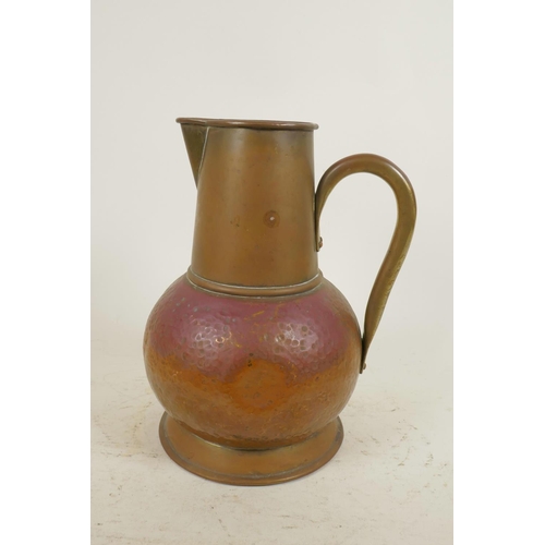 141 - An Arts and Crafts copper jug, together with a coppered metal jelly mould in the form of a fish, 9