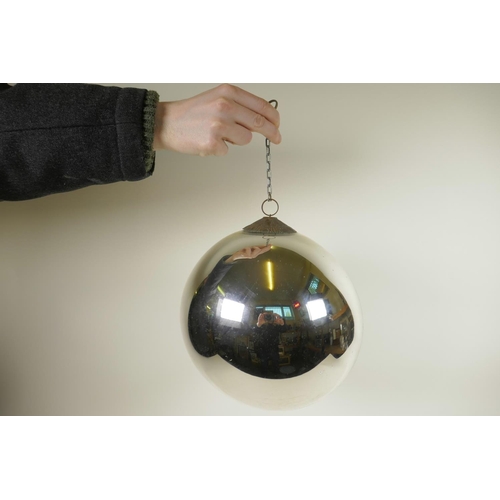 142 - An Art Deco mirrored glass globe with decorative copper hanging attachment, comes with wall bracket,... 