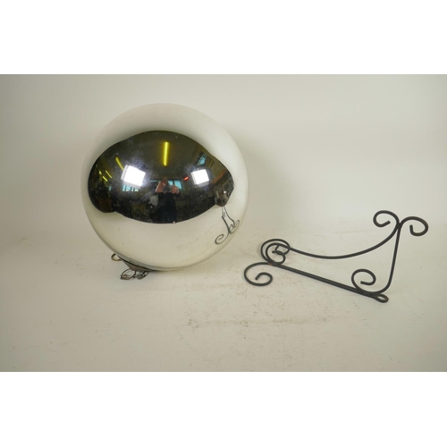 142 - An Art Deco mirrored glass globe with decorative copper hanging attachment, comes with wall bracket,... 