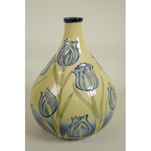 144 - A Moorcroft style vase decorated with Liberty style tulips, 12