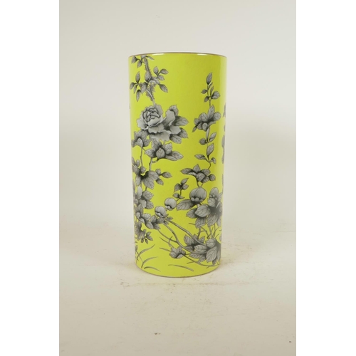 158 - A Chinese yellow ground porcelain cylinder vase with black and white floral decoration, red inscript... 