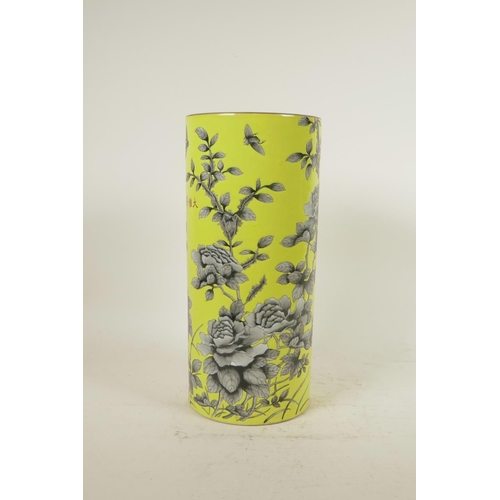 158 - A Chinese yellow ground porcelain cylinder vase with black and white floral decoration, red inscript... 