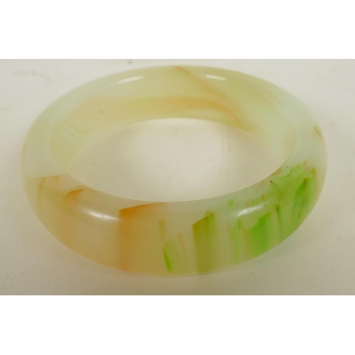 167 - A Chinese banded hardstone bangle, 3¼