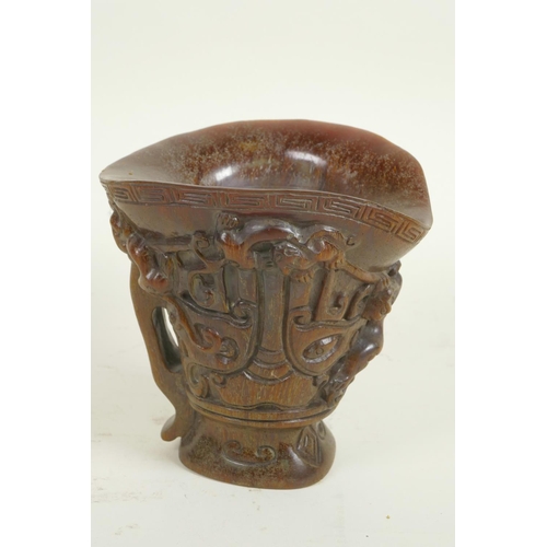 169 - A Chinese faux horn libation cup with mythical animal decoration, 5½