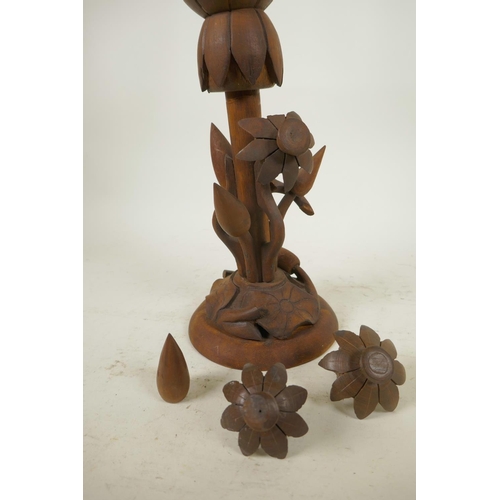 174 - An oriental mid C20th wooden lotus flower metamorphic table lamp, with carved floral base and double... 