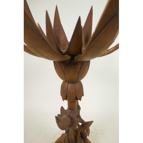 174 - An oriental mid C20th wooden lotus flower metamorphic table lamp, with carved floral base and double... 