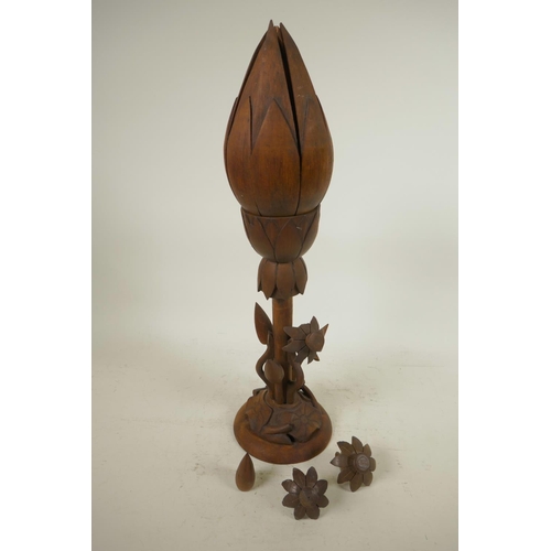 174 - An oriental mid C20th wooden lotus flower metamorphic table lamp, with carved floral base and double... 