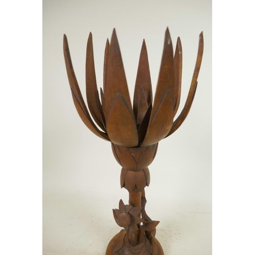 174 - An oriental mid C20th wooden lotus flower metamorphic table lamp, with carved floral base and double... 