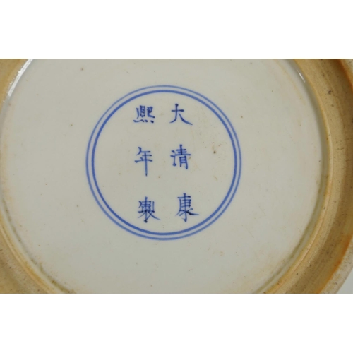 175 - A Chinese famille verte porcelain charger, with a figure in front of a screen, 6 character mark to b... 