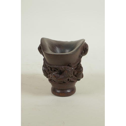 18 - A Chinese carved bamboo libation cup decorated with climbing kylin, seal mark to base, 3