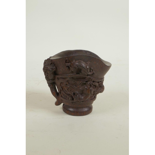 18 - A Chinese carved bamboo libation cup decorated with climbing kylin, seal mark to base, 3