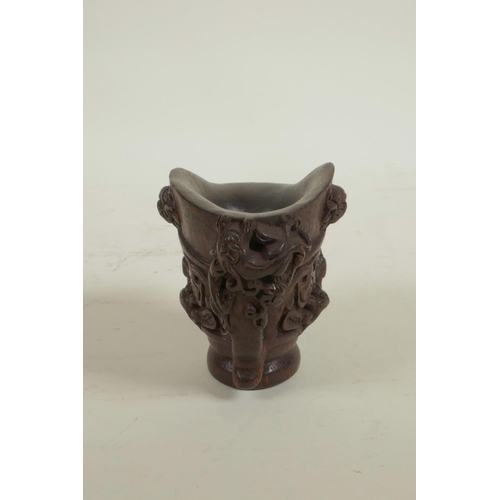 18 - A Chinese carved bamboo libation cup decorated with climbing kylin, seal mark to base, 3