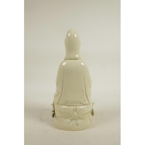 183 - A Chinese blanc de chine porcelain figure of Quan Yin seated on a lotus throne, impressed marks vers... 