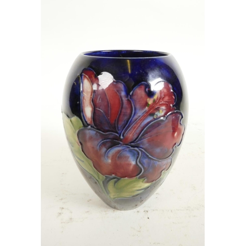 186 - Two Moorcroft vases, a mid C20th Moorcroft 'Hibiscus' pattern squat vase, tube-lined flowers and fol... 