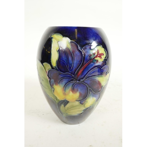 186 - Two Moorcroft vases, a mid C20th Moorcroft 'Hibiscus' pattern squat vase, tube-lined flowers and fol... 