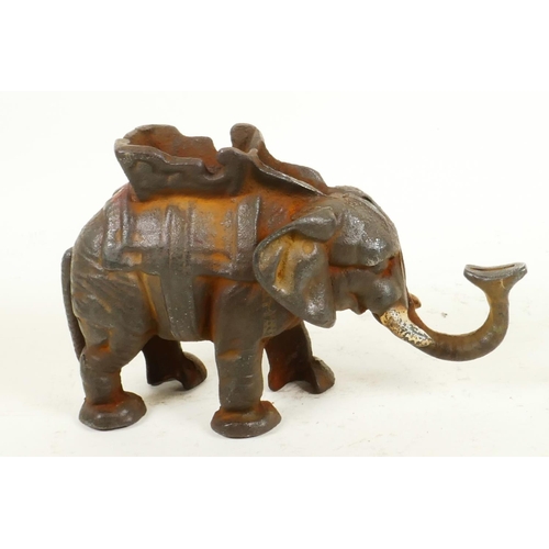 198 - A cast iron trick moneybox cast as an elephant with howdah, 5