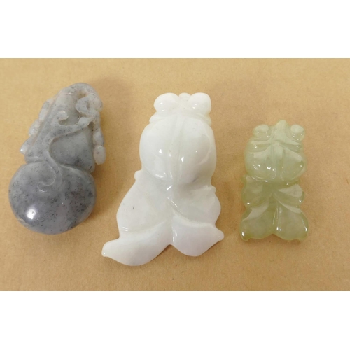 199 - Three small Chinese carved jade amulets, largest 1½