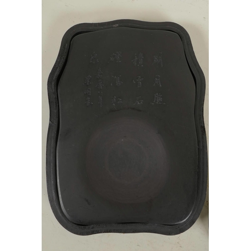 206 - A Chinese ink stone with engraved character inscription, in a lacquer box with mother of pearl style... 