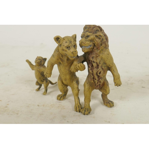 209 - A cold painted bronze figure of three lions, 2½