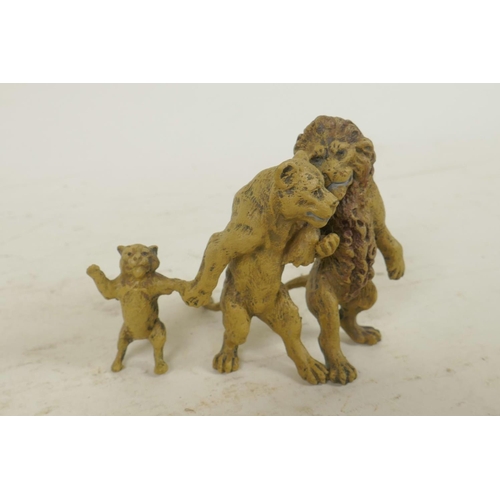 209 - A cold painted bronze figure of three lions, 2½