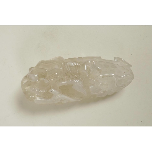 216 - A Chinese carved rock crystal paperweight in the form of a vine, 4½