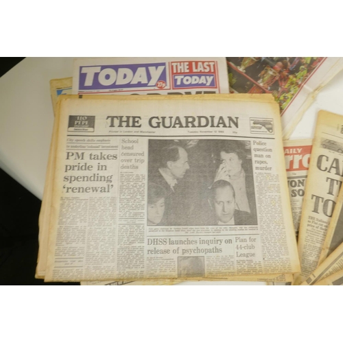 219 - A collection of 1980 newspapers relating to the murder of John Lennon, together with a larger collec... 