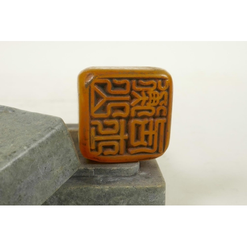 222 - A Chinese amber soapstone seal in a hardstone box with carved gourd decoration, 2½