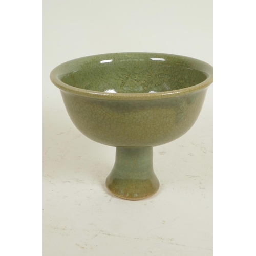 224 - A Chinese celadon glazed porcelain stem bowl, 4½