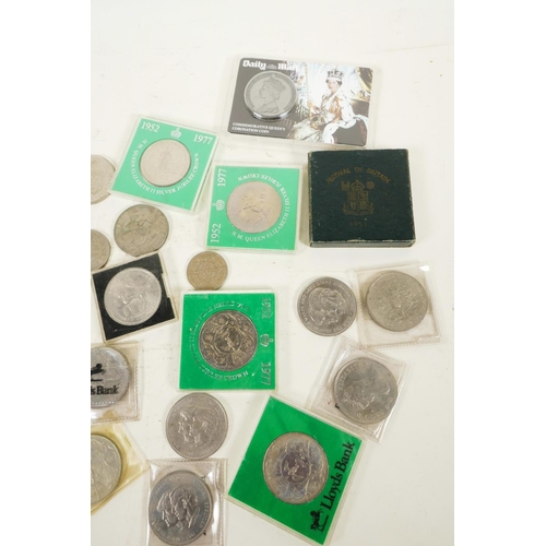 229 - A quantity of British crown coins, mainly Queen Elizabeth II, and three commemorative first day cove... 