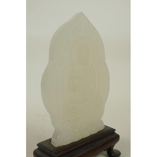 238 - A Chinese white hardstone ornament in a hardwood stand with carved Buddha decoration, 6½