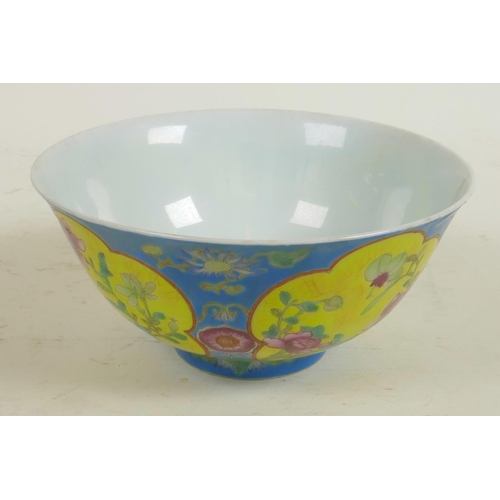 242 - A Chinese porcelain bowl with blue glaze and floral panels, red seal mark to base, 6