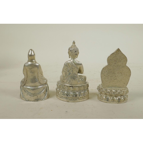 243 - Three Chinese white metal cast figures of Buddha and Quan Yin, largest 3½