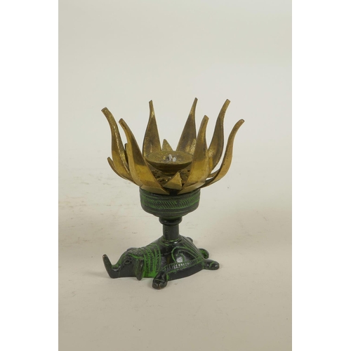 247 - An Indian bronze oil lamp in the form of a lotus flower on an elephant shaped base, opening to revea... 