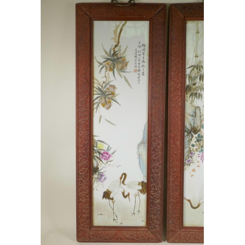 251 - A pair of Chinese Republic period porcelain panels depicting cranes, fruit and flowers, in carved ha... 