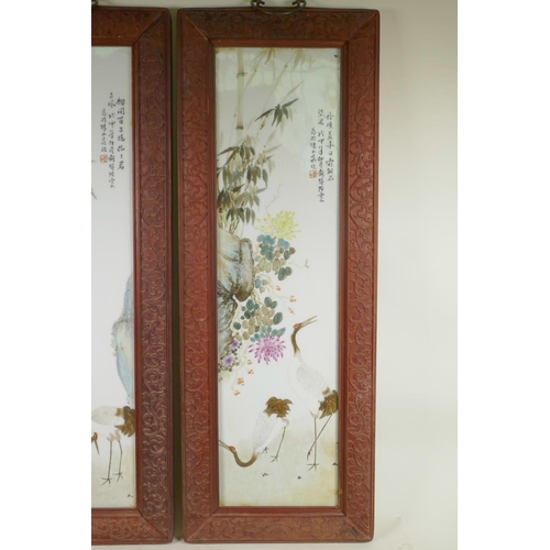 251 - A pair of Chinese Republic period porcelain panels depicting cranes, fruit and flowers, in carved ha... 