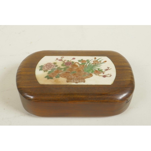 258 - A small Japanese hardwood box, the cover with inset bone panel decorated with a basket of flowers, 4... 